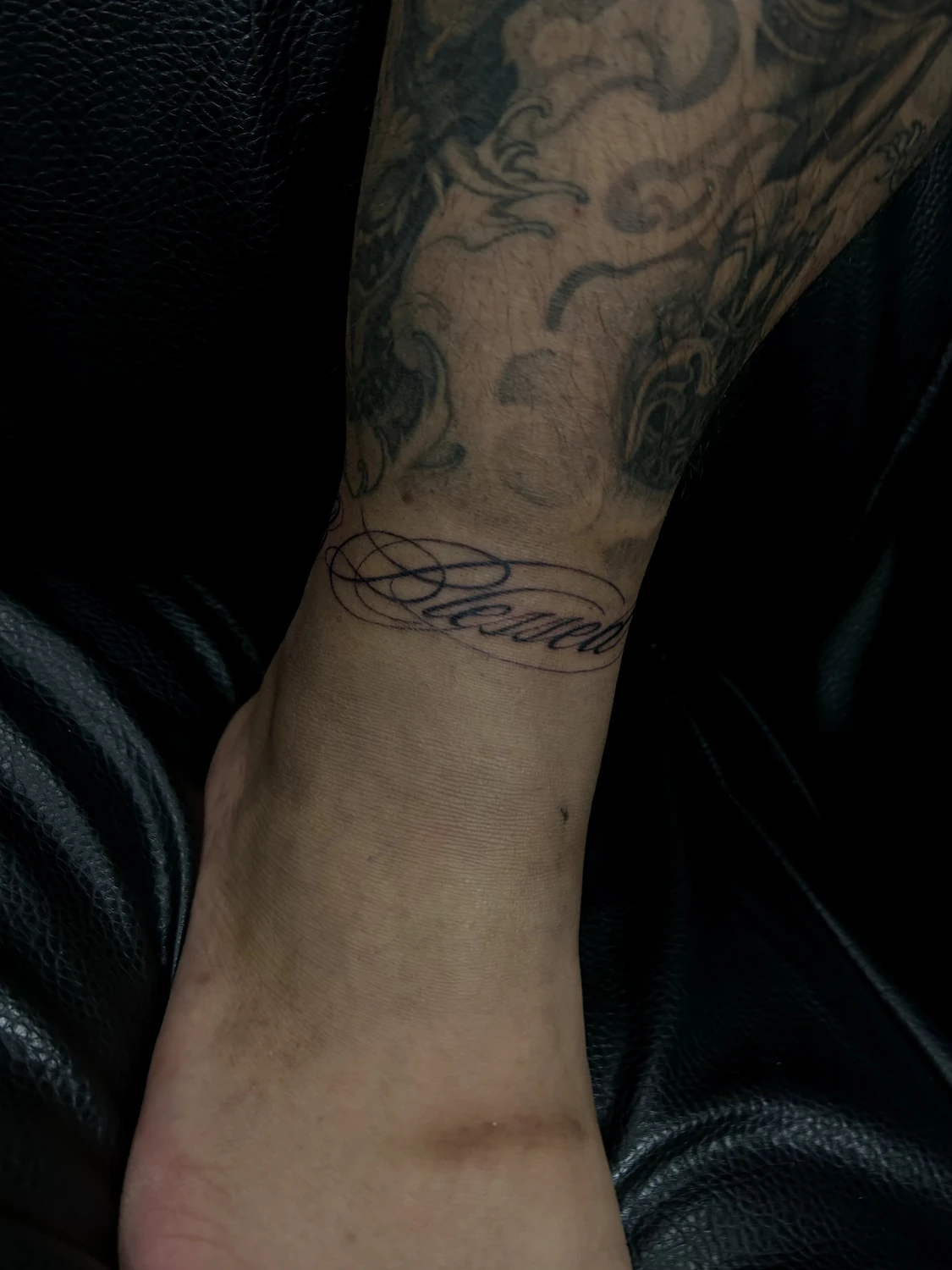 Lettering ankle tattoo by Billy, San Jose CA